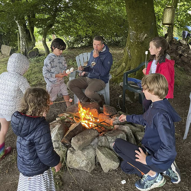 Family glamping campfire