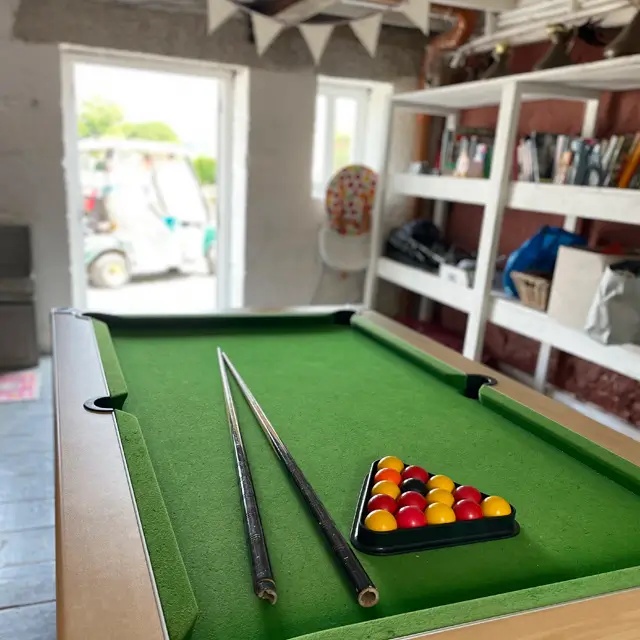 The pool table in the game room in old forge glamping